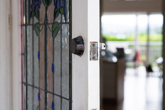 open front door of a queenslander home, with key