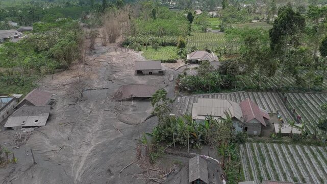 Aftermath of semeru volcano eruption damaging village