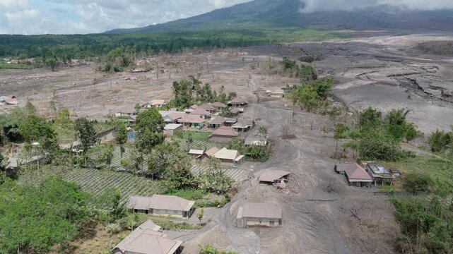 Aerial view of a village devastated by semeru volcano lava flow in indonesia
