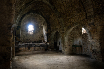 Fototapeta premium Interior of an ancient Armenian church, featuring historic stone architecture, intricate carvings, and serene spiritual ambiance reflecting centuries of religious heritage.