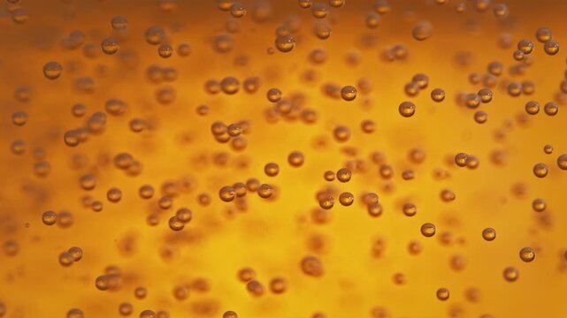 Air Bubbles Moving In Orange Liquid - Light Beer In Macro And Slow Motion