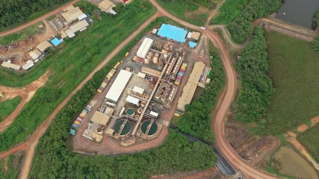 Aerial view of a gold mining processing plant in a jungle environment