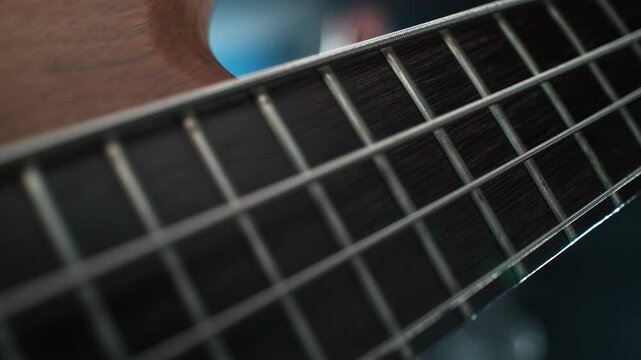 Playing Bass Guitar - Strings Hit With Finger Vibrate In Slow Motion And Macro
