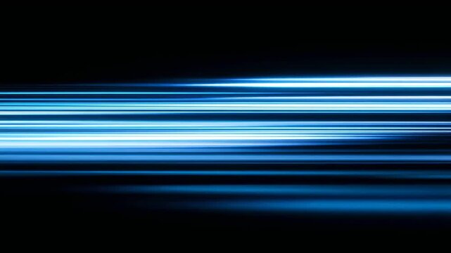 High speed blue light streaks moving horizontally on black background.