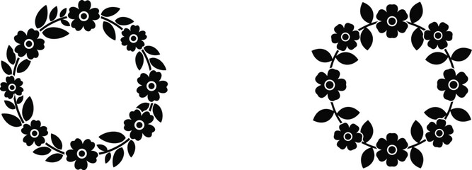 Black floral hoop earrings on white background © Abdus