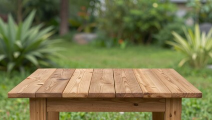 Fototapeta premium Wooden table presents a rustic surface amidst the greenery