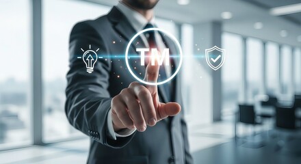 Businessman touching virtual trademark icon for intellectual property protection