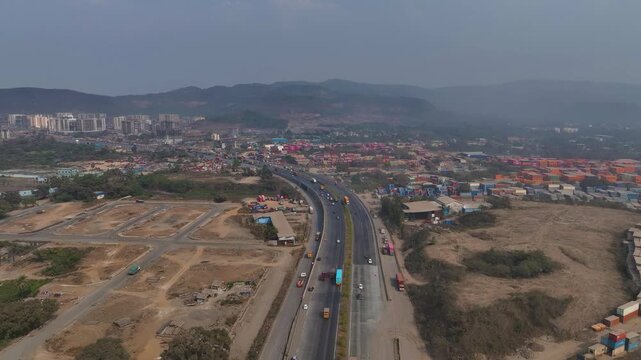 Aerial drone view of Atal Setu in Mumbai, India. The modern sea bridge stretches across the Arabian Sea, connecting the city to Navi Mumbai and showcasing large-scale infrastructure development, urban
