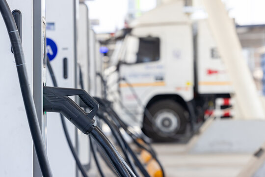EV charging and semi truck electric vehicle, Electric vehicle semi truck trailer charging station for charge EV battery, Plug for vehicle electric engine, EV charger semi truck trailer station.