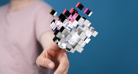 Abstract concept of digital interaction and technology. Hand touching a 3D cube representing innovation, data and conne