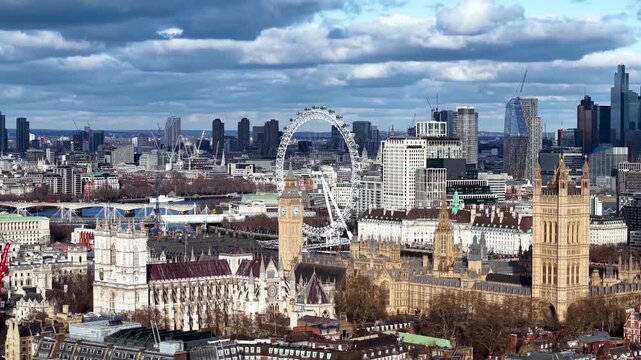 Aerial view of the Westminster Palace with Elizabeth Tower and Westminster Abbey and City skyline of London, England, in the background