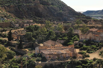 Obraz premium Abandoned settlement and mining ruins set within dramatic canyon like terrain in Mazarrón, Spain