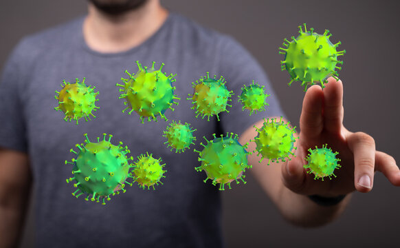 Abstract conceptual image of a man touching virus particles. Representing health risks, illness, and the sprea