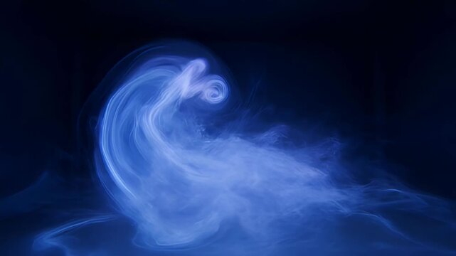 Swirling blue smoke forms a mesmerizing spiral on dark background - 4k video
