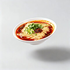 Delicious spicy noodle soup with garnishes in a bowl
