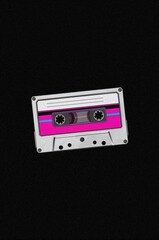 Fototapeta premium Centered retro cassette tape illustration with neon chrome aesthetic on deep black background
