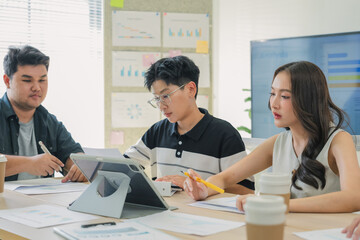 Fototapeta premium Business professionals discussing strategy in office meeting using tablet analytics and reports, teamwork collaboration analyzing market data, corporate planning session driving innovation, productivi