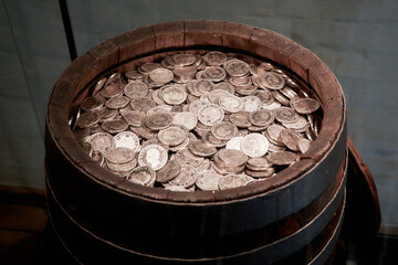 Historic Silver Coins in a Wooden Barrel © fotowunsch
