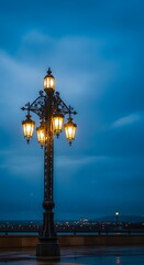 Vintage Street Lamp with Ornate Design Illuminating a Twilight Sky over a Distant Cityscape