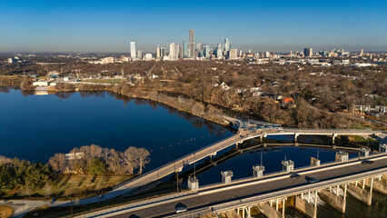 Aerial drone image of the Wishbone Bridge crossing Lady Bird Lake near Longhorn Dam in East Austin, Texas. © Scott