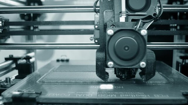 3D printer. 3D printer printing object close-up. 3D printer printing model blue color. Working 3D printer. Concept printing technology. New modern additive progressive technology. FDM technologies
