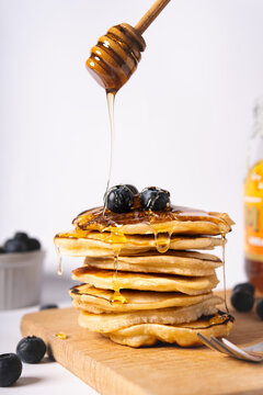 Pancakes with fruit and honey