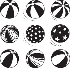 Collection of black and white beach balls with various patterns and designs isolated