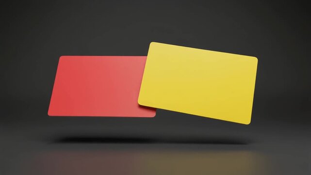 Red and Yellow Cards: A conceptual display of a red card and a yellow card. The bold colors stand out against the dark background.