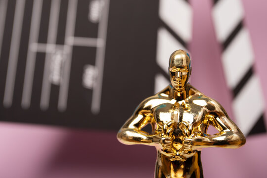 Oscar award on pink background, female award, movie prize honoring storytelling and cinematography,Moscow, Russia, January 21, 2025