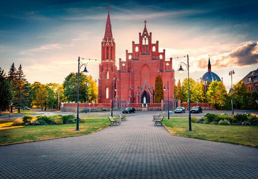 Wonderful morning view of red briks St. Matthew Apostle Catholic Churc h. Majestic summer cityscape of Rokiskis town, Latvia, Europe. Traveling concept background.