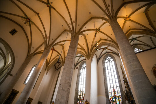 Interior of Eichst&auml;tt Cathedral, a cathedral church in the Diocese of Eichst&auml;tt in Bavaria, with towering columns, vaults, and large stained glass windows.