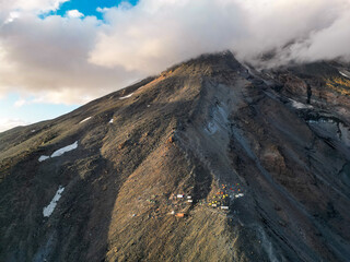 Aerial drone view of Mount Ararat volcanic peak with barren rocky slopes and dramatic clouds © AndriiDuhin