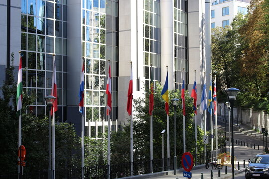 Brussels / Belgium - September 9, 2016: Flags of members states of EU outside of European Parliament building in Brussels.