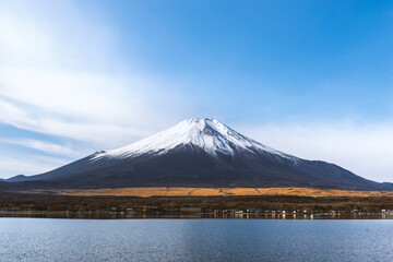 Scenic landscape of Mount Fuji with snow-capped peak and Lake Yamanaka