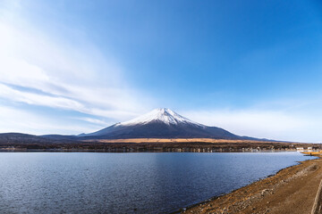 Scenic landscape of Mount Fuji with snow-capped peak and Lake Yamanaka