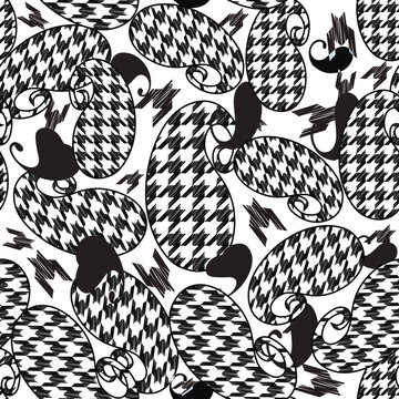 Modern seamless pattern combining classic paisley shapes with houndstooth textures. Stylish black and white vector background for trendy fashion apparel, textile prints, and abstract decor.