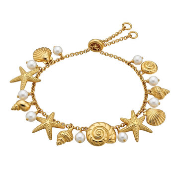 Golden charm bracelet with ocean-themed charms isolated on transparent background