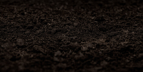 Dark brown soil texture for gardening and growth backgrounds