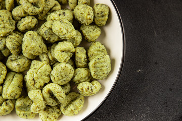 Gnocchi with spinach tasty snack fresh gourmet food background on the table rustic food top view copy space vegetarian and vegan food marketing concept photo