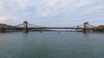Obraz premium The Szechenyi Chain Bridge is a suspension bridge that spans the River Danube between Buda and Pest, the western and eastern sides of Budapest, the capital of Hungary. 