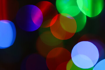 Soft abstract bokeh lights in vibrant colors create a dreamy, defocused background, perfect for festive designs, modern visuals, nightlife themes, and creative branding.