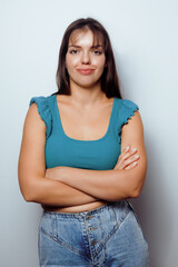 Confident Young Woman with Arms Crossed