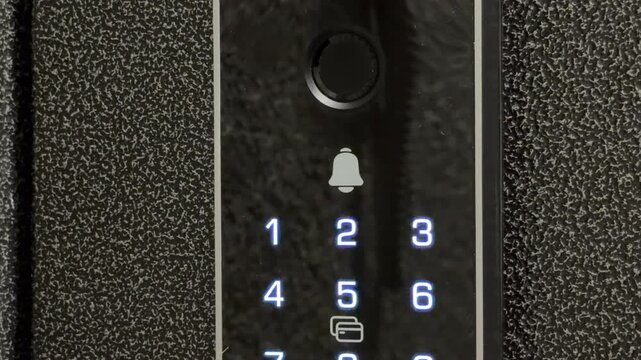 Bright blue numbers glow on a sleek black digital keypad as the smart lock activates. The high-tech interface creates a sense of modern security and effortless access.