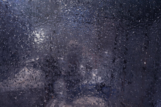 A window with a frosted glass that has a blurry background