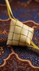 Woven Bamboo Bag on Ornate Rug.