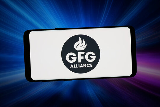 Stuttgart, Germany - 02-19-2026: In this photo illustration, the logo of company Gupta Family Group Alliance (GFG) is displayed on a smartphone in front of abstract background on computer screen.