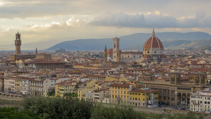 Fototapeta premium Panoramic view of Florence, Italy, at sunset. Famous view on Firenze and Santa Maria del Fiore Cathedral from the Michelangelo Square (Piazzale Michelangelo) in Florence, Tuscany, Italy