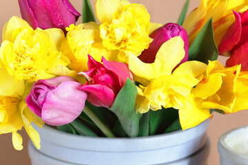 Spring flowers bouquet  on beige background, closeup, texture or banner, nursery and spring gardening concept, closeup, copy space
