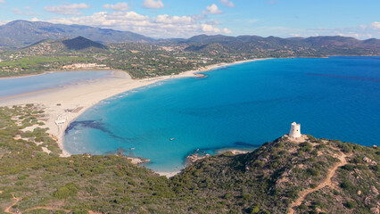Obraz premium scenic view of historic tower and coast, panoramic image of old tower overlooking turquoise waters