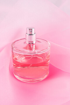 Elegant perfume bottle with pink organza fabric